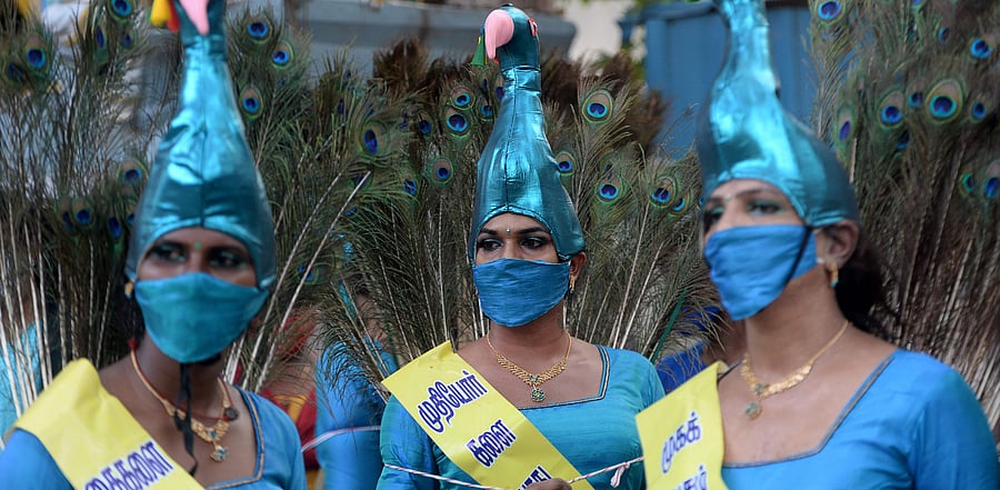 Members of the transgender community perform a peacock dance during an awareness raising campaign against the spread of the Covid-19 in Chennai. Credit: PTI Photo