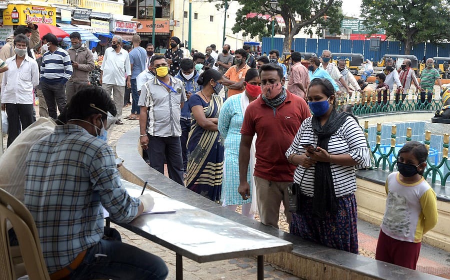 Health department staff conducted Covid-19 test in Mysuru recently. DH FILE PHOTO 