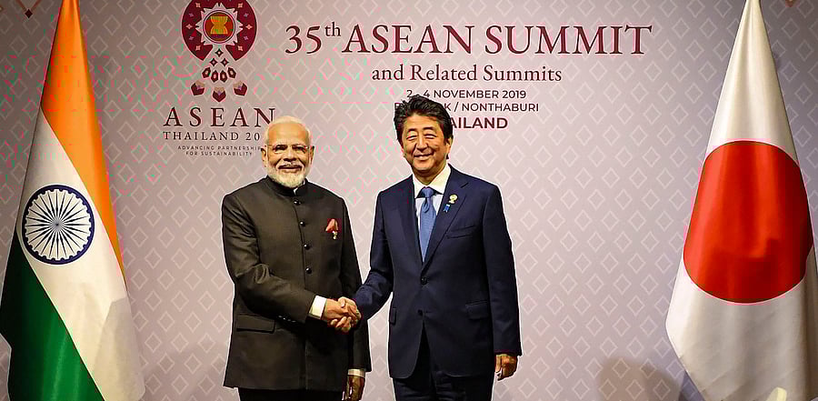 Prime Minister Narendra Modi shakes hands with his Japanese counterpart Shinzo Abe. Credit: PTI File Photo