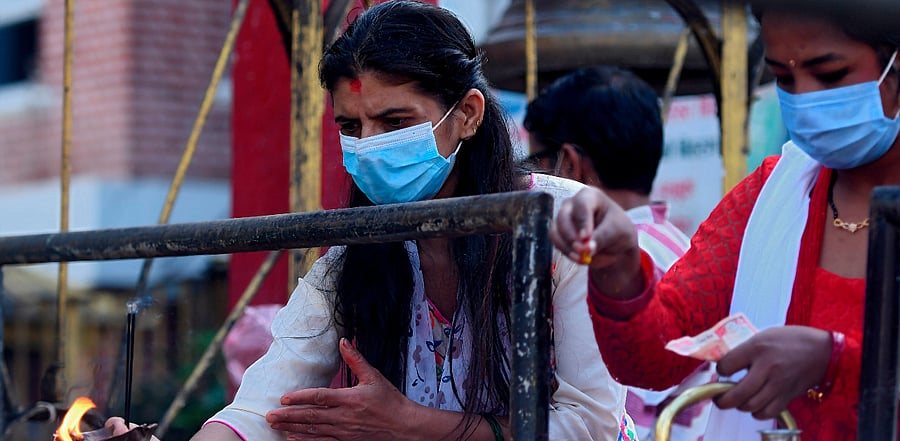 Nepali Hindu women pay homage to Hindu god Shiva as they celebrate the Teej festival outside the Pashupatinath temple. Credit: AFP Photo