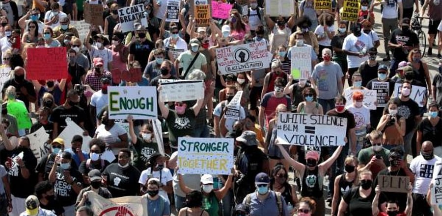 People march in support of Jacob Blake and his family to the Kenosha County Courthouse. Credit: AFP Photo