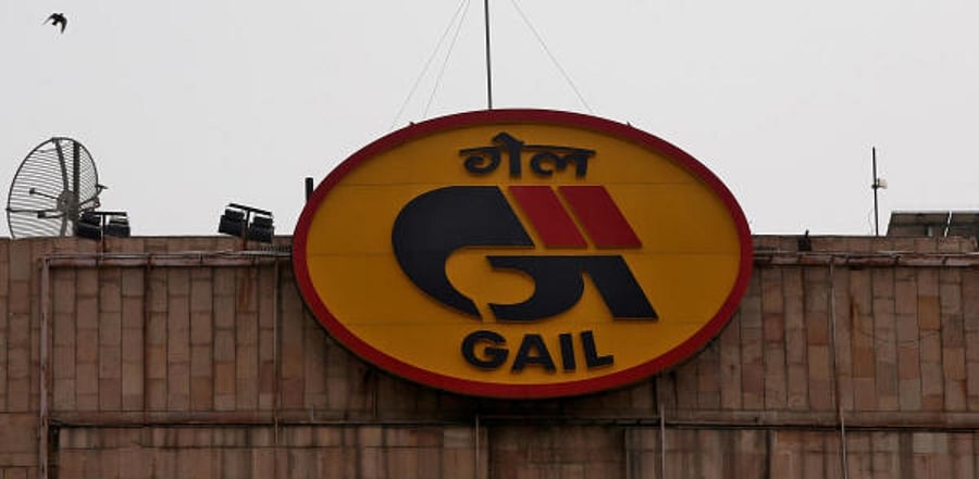 Birds fly past the logo of India's state-owned natural gas utility GAIL (India) Ltd installed on its corporate office building in New Delhi. Credit: Reuters
