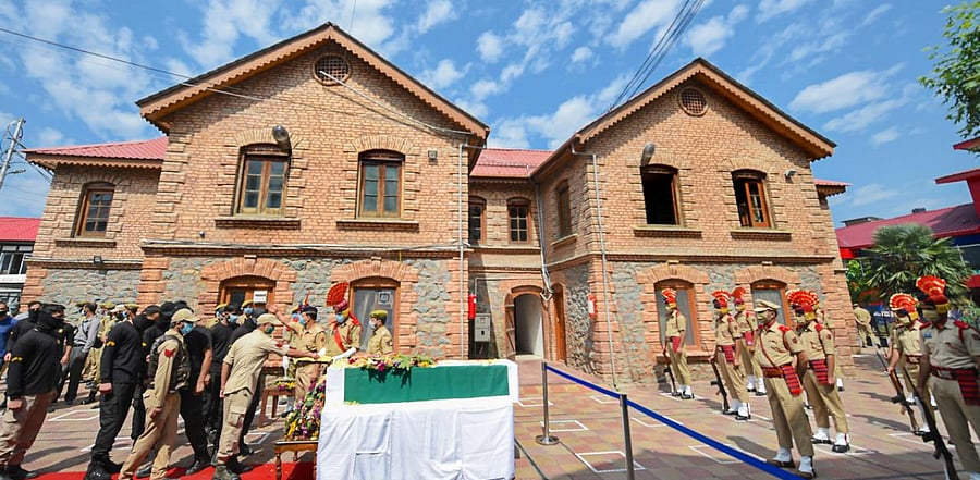 Policemen pay tribute to their colleague ASI Babu Ram who was martyred in an encounter with militants at Pantha Chowk last night, in Srinagar. Credit: PTI Photo