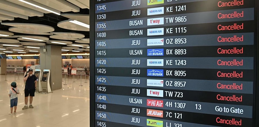 An information board shows cancelled flights ahead of the arrival of Typhoon Maysak in Seoul. Credits: AFP