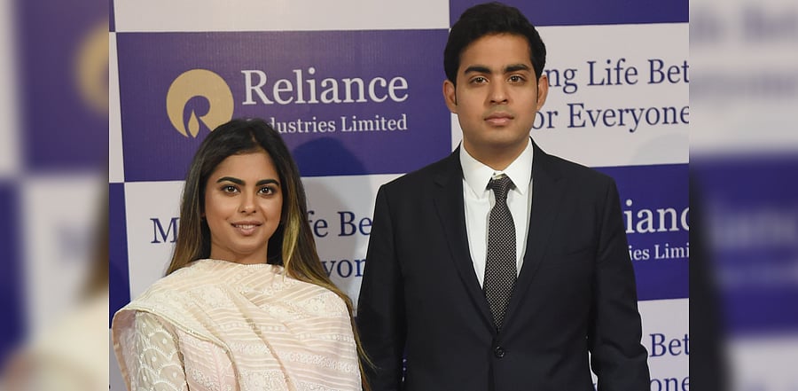 Mukesh Ambani's children Isha (L) and Akash. Credit: AFP