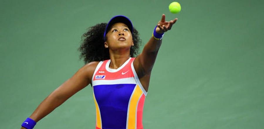 Naomi Osaka of Japan serves the ball against Camila Giorgi of Italy. Credit: USA Today Sports