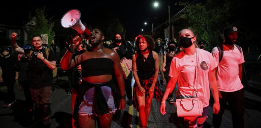 Protesters march to the North Precinct Portland Police Bureau during a demonstration against police violence and racial inequality in Portland. Credit: Reuters