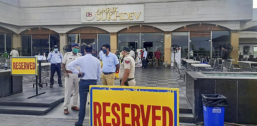 Police and Health officials outside the famous Amrik-Sukhdev Dhaba after sixty-five staffers of the Dhaba tested positive for Covid-19. Credits: PTI