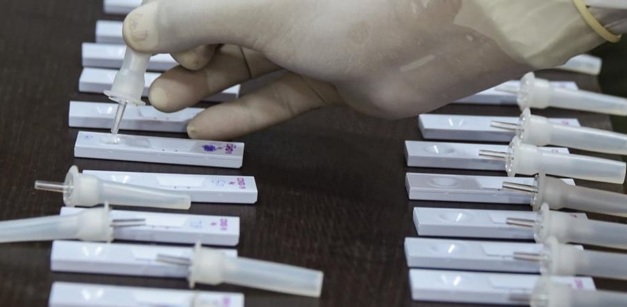 A medic collects samples for Covid-19 rapid antigen test at a government office, in Srinagar, Thursday, Sept. 3, 2020. Credit: PTI Photo