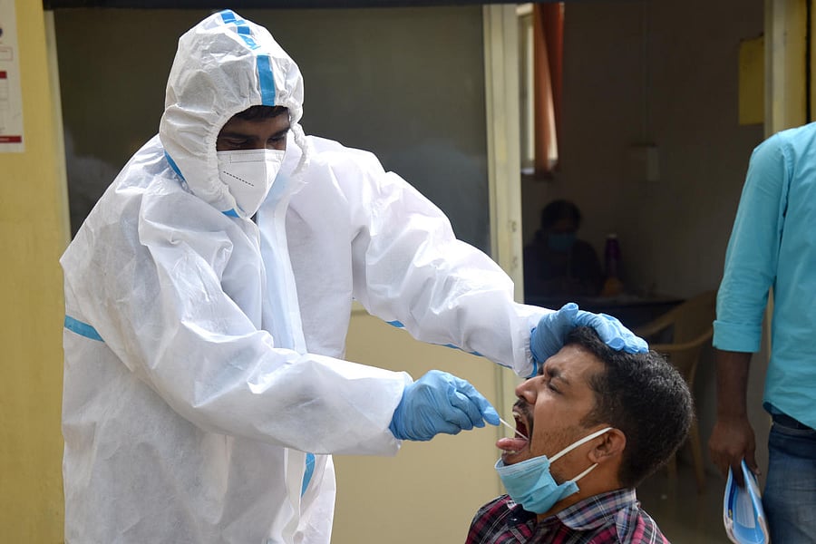 Health staff conducting Coronavirus test at Covid 19 lockdown unlock 04 relief free checkup by BBMP at Sajjan Rao circle in Bengaluru on Friday, 04 September 2020. Photo by S K Dinesh