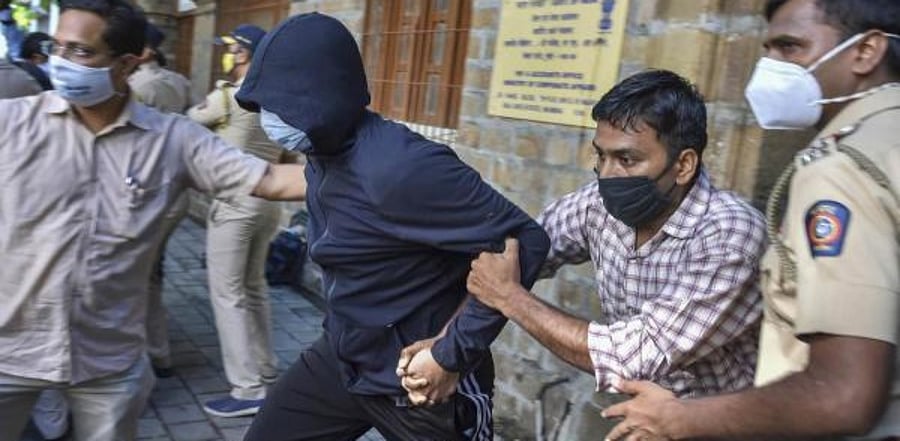 Alleged drug peddler Zaid Vilatra being taken to the court from NCB office by Narcotics Control Bureau (NCB) officers in connection with Sushant Singh Rajput's drug probe, at Ballard Estate in Mumbai. Credit: PTI Photo