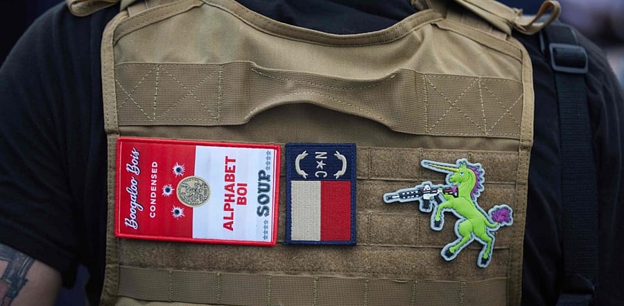 Member of Boogaloo Bois wearing a military vest. Credit: AFP Photo