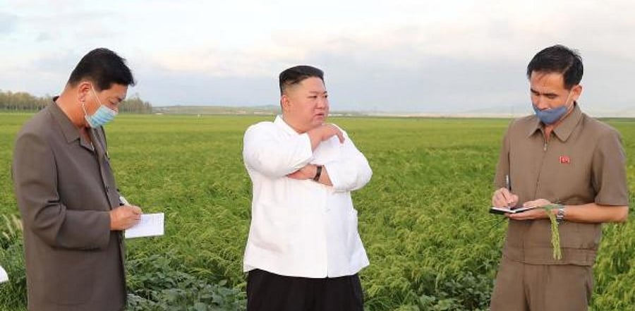 Korean leader Kim Jong Un (C) visits typhoon-stricken area in South Hwanghae Province. Credit: AFP