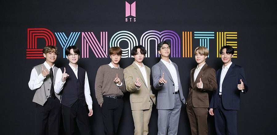 BTS members posing for a photo as they hold an online global media day. Credit: AFP