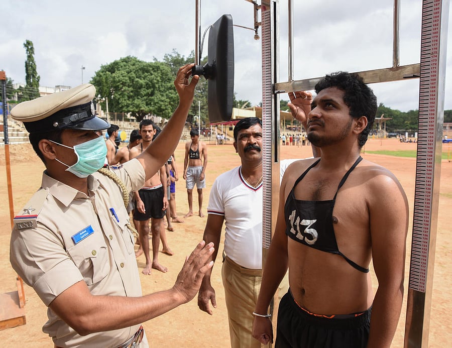 A candidate takes the physical test during a police recruitment drive. DH FILE PHOTO