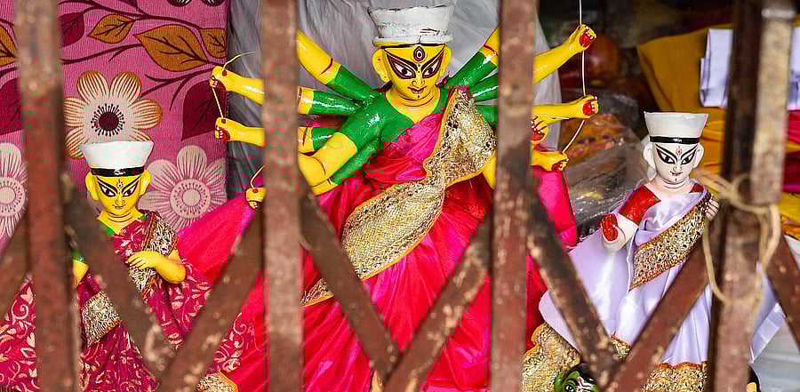 An idol of Goddess Durga inside a studio ahead of the upcoming Durga Puja festival, at Kumartuli in Kolkata. Credit: PTI Photo