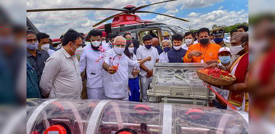Karnataka Chief Minister B S Yediyurappa inaugurates isolation pod-equipped air ambulance (a helicopter fitted with medical equipments), in Bengaluru, Tuesday, Sept. 8, 2020. Credit: PTI Photo