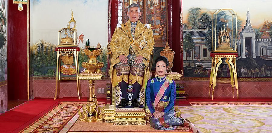 Thailand's King Maha Vajiralongkorn and General Sineenat Wongvajirapakdi, the royal noble consort pose at the Grand Palace in Bangkok, Thailand. Credit: Reuters Photo