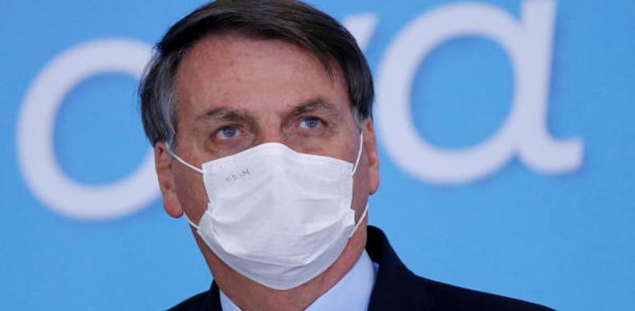 Brazil's President Jair Bolsonaro wearing a protective mask. Credit: Reuters Photo