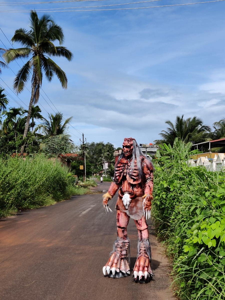 Ravi Katpadi with his unique costume to create awareness on Covid-19.