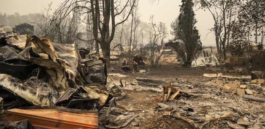 sift through the rubble of Cassos burnt home in a mobile home park on September 11, 2020 in Ashland, Oregon. Credit: AFP Photo