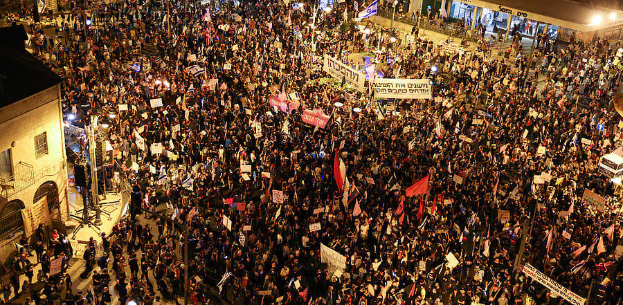 Israeli protesters gather during an anti-government demonstration in front of Prime Minister Benjamin Netanyahu's residence in Jerusalem. Credit: AFP Photo