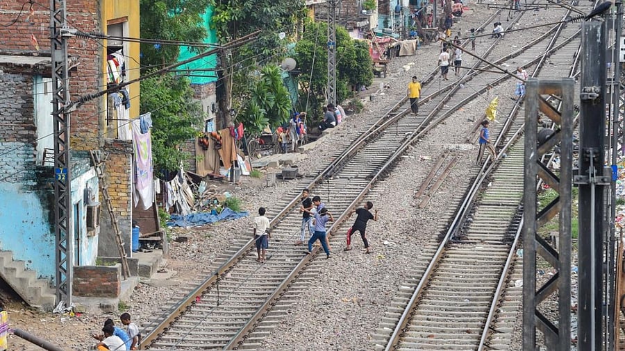 Residents of a slum near Azadpur Railway Station, in New Delhi. Credit: PTI