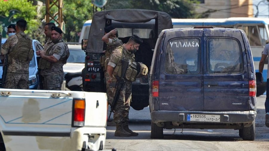 Lebanese soldiers man a checkpoint after being deployed in the Beddawi area near the northern port city of Tripoli. Credit: AFP