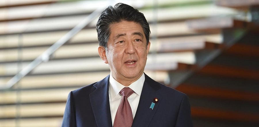 Japan’s outgoing Prime Minister Shinzo Abe speaks to the media upon his arrival at the his office in Tokyo. Credit: AFP