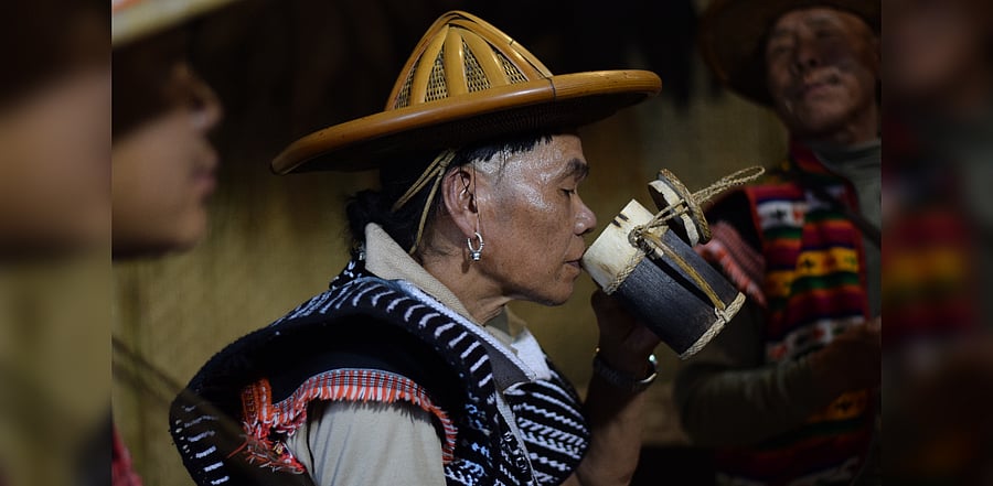 An Idu Mishmi elder man enjoying his drink in Dibang Valley in Arunachal Pradesh. Credit: Mishmi Hills Photo Agency