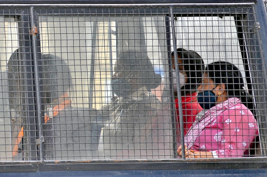 Kannada actress Sanjjanaa Galrani (in red kurti) being moved to court after a medical check-up in Bengaluru on Wednesday. DH PHOTO/PUSHKAR V