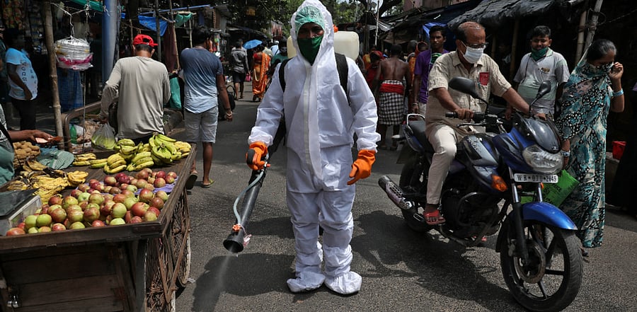 A municipal worker sprays disinfectant to sanitize a street amidst the spread of the coronavirus disease. Credits: Reuters Photo