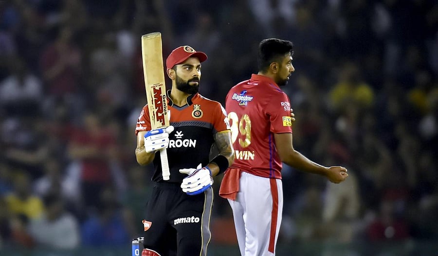 RCB's batsman Virat Kohli celebrates his fifty during the Indian Premier League (IPL T20 2019) cricket match between Royal Challengers Bangalore (RCB) and Kings XI Punjab( KXIP) at I S Bindra Stadium in Mohali, Saturday, April 13, 2019. (PTI Photo)