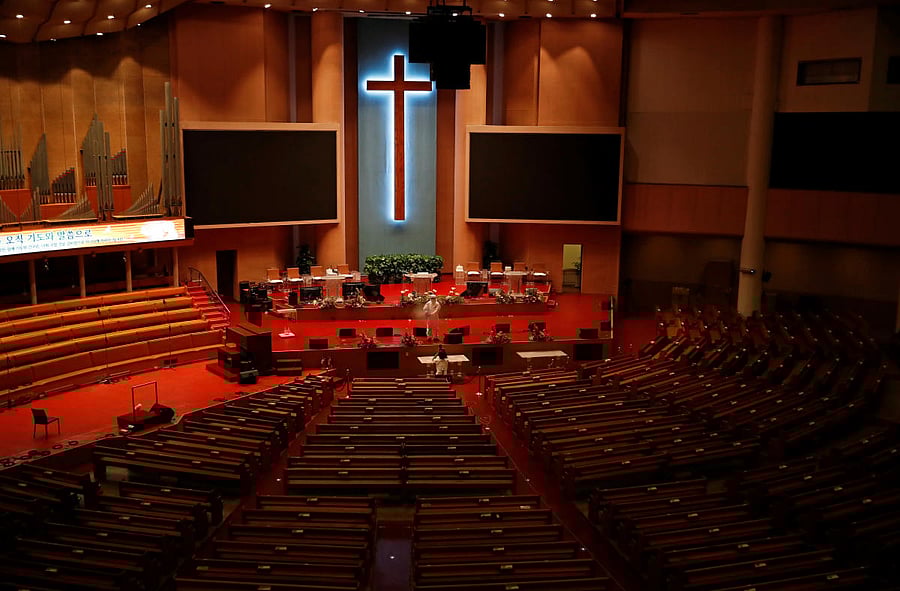 A member of a disinfection company sanitises the Yoido Full Gospel Church, which is the largest church in the country, in Seoul, South Korea. Credit: Reuters