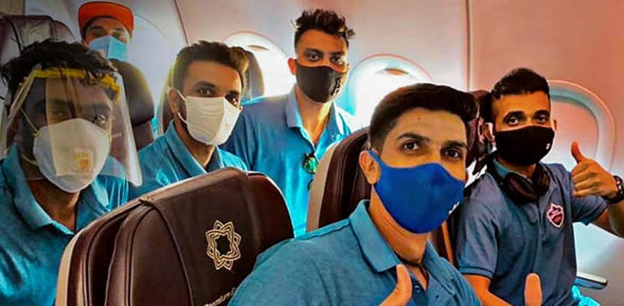 Delhi Capitals players Ishant Sharma, Ajinkya Rahane, Ravichandran Ashwin and others pose for photographs before leaving for UAE to participate in IPL 2020. Credit: PTI Photo