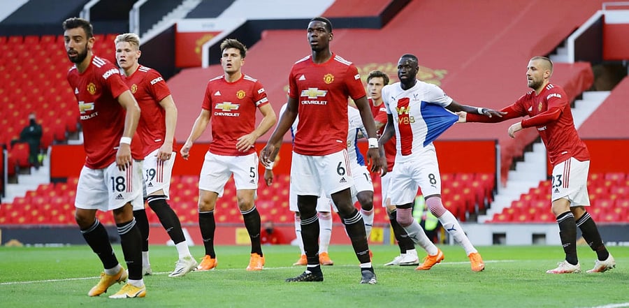 Manchester United's Luke Shaw with Crystal Palace's Cheikhou Kouyate Pool. Credit: Reuters
