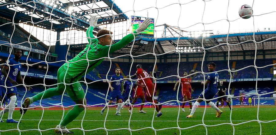 Liverpool's Senegalese striker Sadio Mane (C) heads the ball to score past Chelsea's Spanish goalkeeper Kepa Arrizabalaga during the English Premier League football match between Chelsea and Liverpool. Credit: AFP Photo