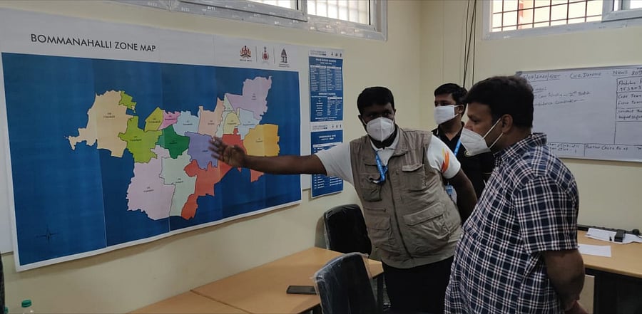 The staff of the Bommannahalli Zone at the BDA commercial complex of HSR Layout, Covid-19 War Room, were briefed by Mayor M Gautam Kumar. Credit: DH Photo