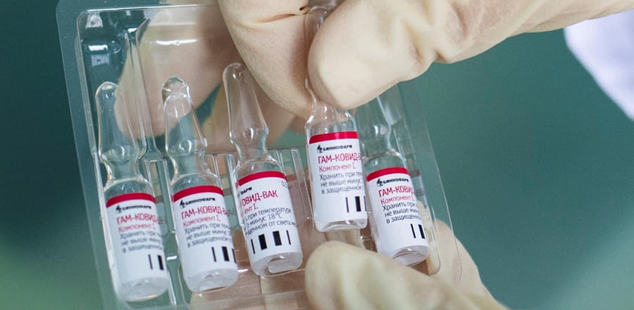An employee demonstrates vials with "Gam-COVID-Vac" vaccine against the coronavirus disease. Credit: Reuters