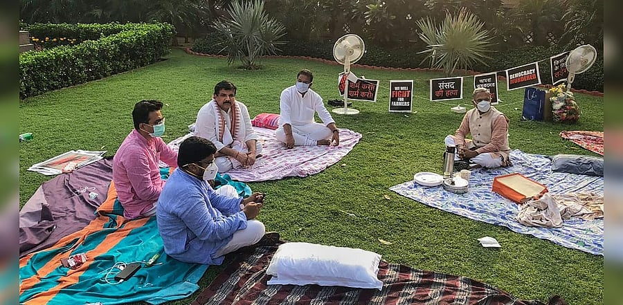 Deputy Chairman of the Rajya Sabha Harivansh Narayan Singh offers tea to suspended MPs at the premises of Parliament House, as they stage a protest over their suspension from the remaining Monsoon Session of Parliament over the ruckus created in Rajya Sabha, in New Delhi, Tuesday morning, Sept. 22, 2020. Credit: PTI Photo