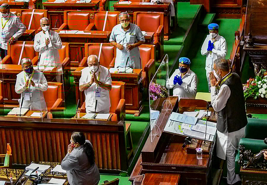 Karnataka CM B S Yediyurappa (C) and other legislators greet Speaker Vishweshwar Hegde Kageri (L) during the ongoing Monsoon Session. Credits: PTI Photo