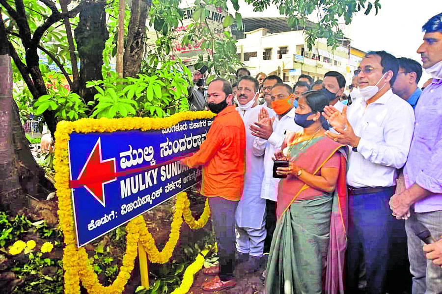 Mayor Diwakar cuts the ribbon to mark the renaming of Light House Hill road as Mulki Sunder Ram Shetty Road, on Wednesday.