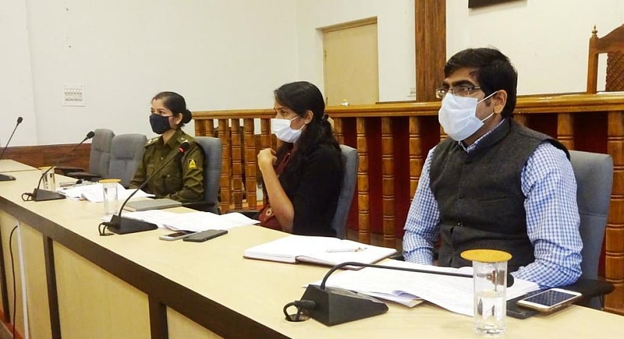 Deputy Commissioner Annies Kanmani Joy chairs a progress review meeting of Department of Women and Child Welfare at DC's office in Madikeri on Wednesday. Superintendent of Police Kshama Mishra and Zilla Panchayat CEO Bhanwar Singh Meena look on. DH Photo