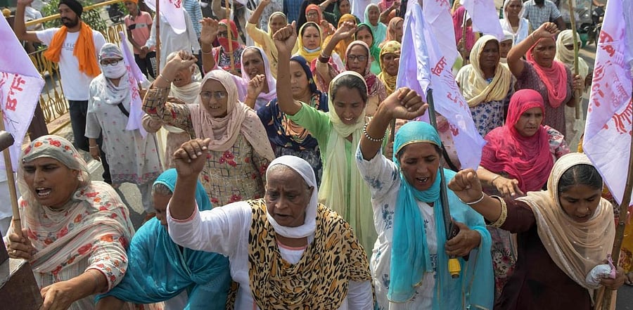Farmers shout slogans against Indian Prime Minister Narendra Modi's government as they march towards city during a nationwide farmers' strike following the recent passing of agriculture bills in the Lok Sabha (lower house), on the outskirts of Amritsar. Credit: AFP