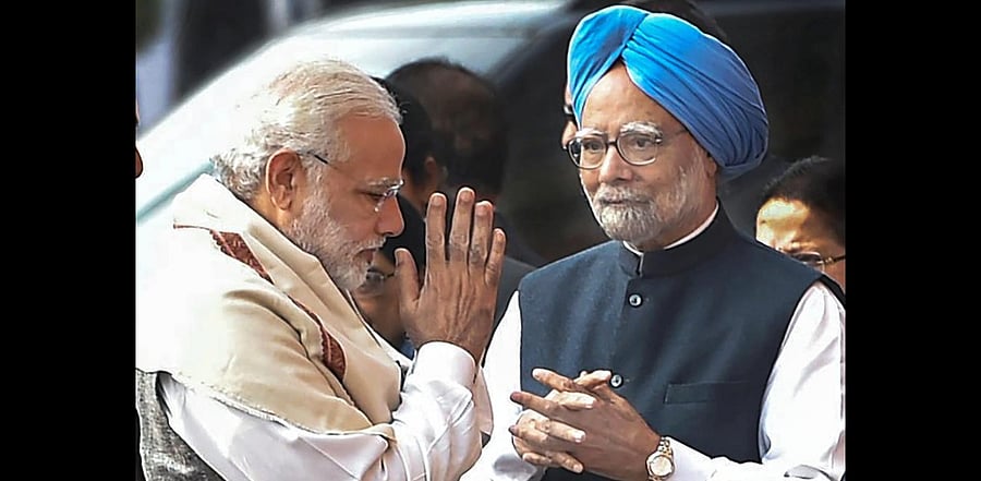 Prime Minister Narendra Modi and former prime minister Manmohan Singh exchange greetings. Credit: PTI