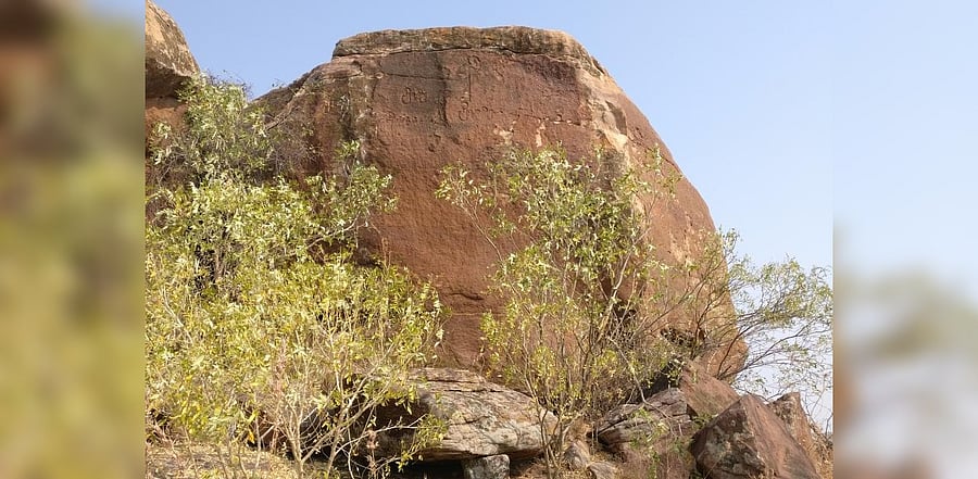 A rock face with inscriptions and a symbol at Motara Maradi. Photo credit: Srikumar M Menon