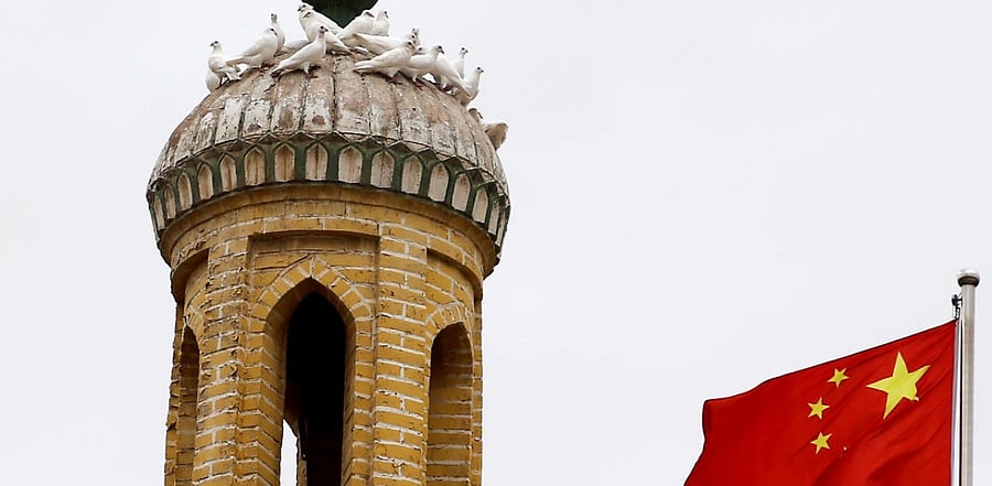 A Chinese national flag in Xinjiang Uighur Autonomous Region. Credit: Reuters Photo