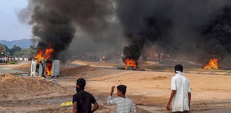 Vehicle and trye's torched during a protest demanding recruitment of reserved category candidates on vacant unreserved positions for teachers from the year 2018, in Kakari Dungri village of Dungarpur district. Credit: PTI Photo