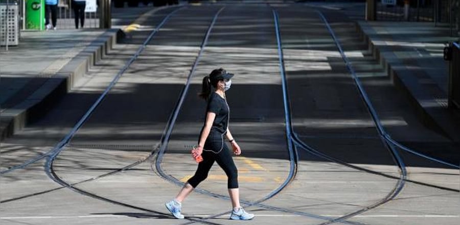 A woman takes a walk in Melbourne on September 6, 2020 as the state announced an extension to its strict lockdown law while it battles fresh outbreaks of the Covid-19 coronavirus. Credit: AFP Photo