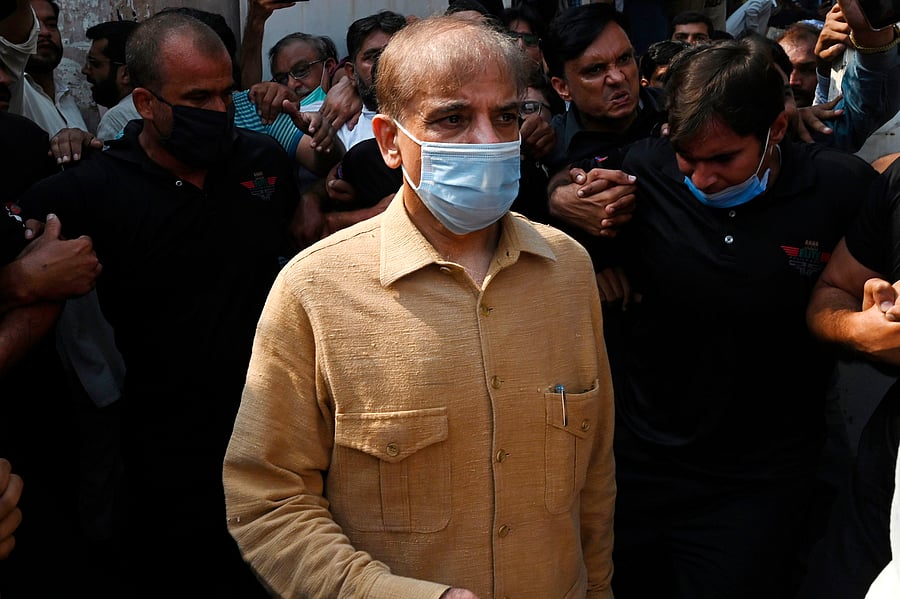 Pakistan's opposition leader Shahbaz Sharif (R) leaves the High Court in Lahore on September 24, 2020, after the Lahore High Court (LHC) extended his interim bail in the money laundering case till September 28. Credit: AFP